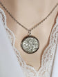 Silver round floral etched locket necklace by Papillion Era