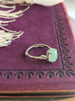 Natural Green Aventurine Solitaire Ring - Sterling Silver - Handmade Gemstone Jewelry - Made in Toronto on a purple fabric background