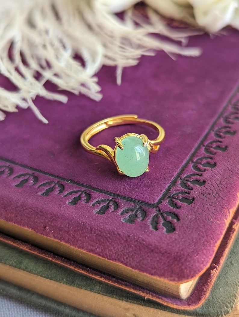 Natural Green Aventurine Solitaire Ring - 18K Gold Vermeil over Sterling Silver - Handmade Gemstone Jewelry - Made in Toronto on a purple vintage book 