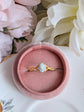 Matte gold cameo ring with single loop shoulder detail in pink jewelry box.