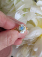 Gold Vermeil Blue Rose Ring - 925 Sterling Silver - Victorian Floral Jewelry held between white flowers