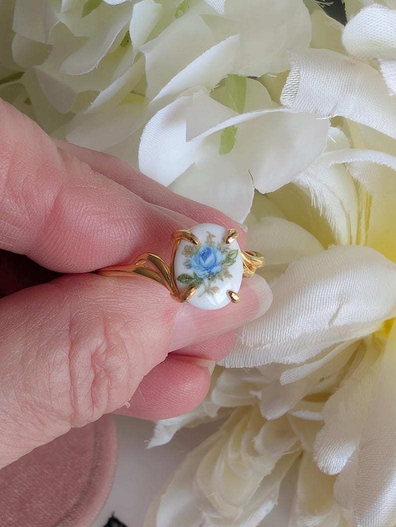 Gold Vermeil Blue Rose Ring - 925 Sterling Silver - Victorian Floral Jewelry held between white flowers
