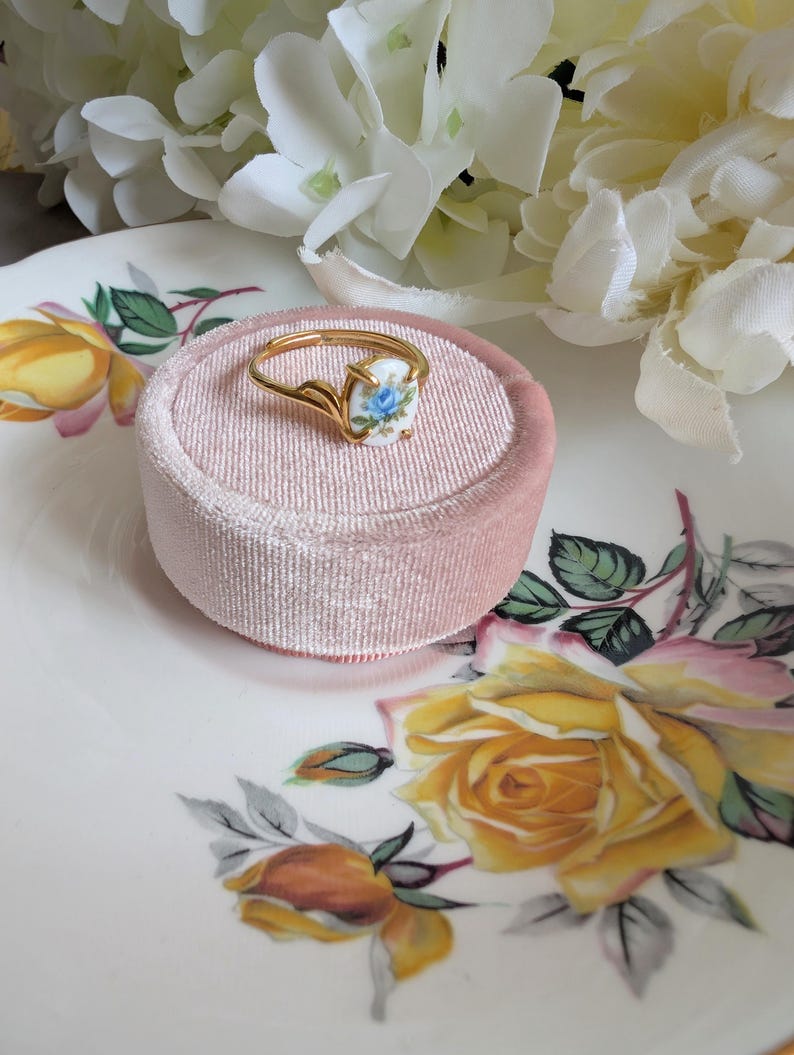 Gold Vermeil Blue Rose Ring - 925 Sterling Silver - Victorian Floral Jewelry on a pink velvet box against a floral background