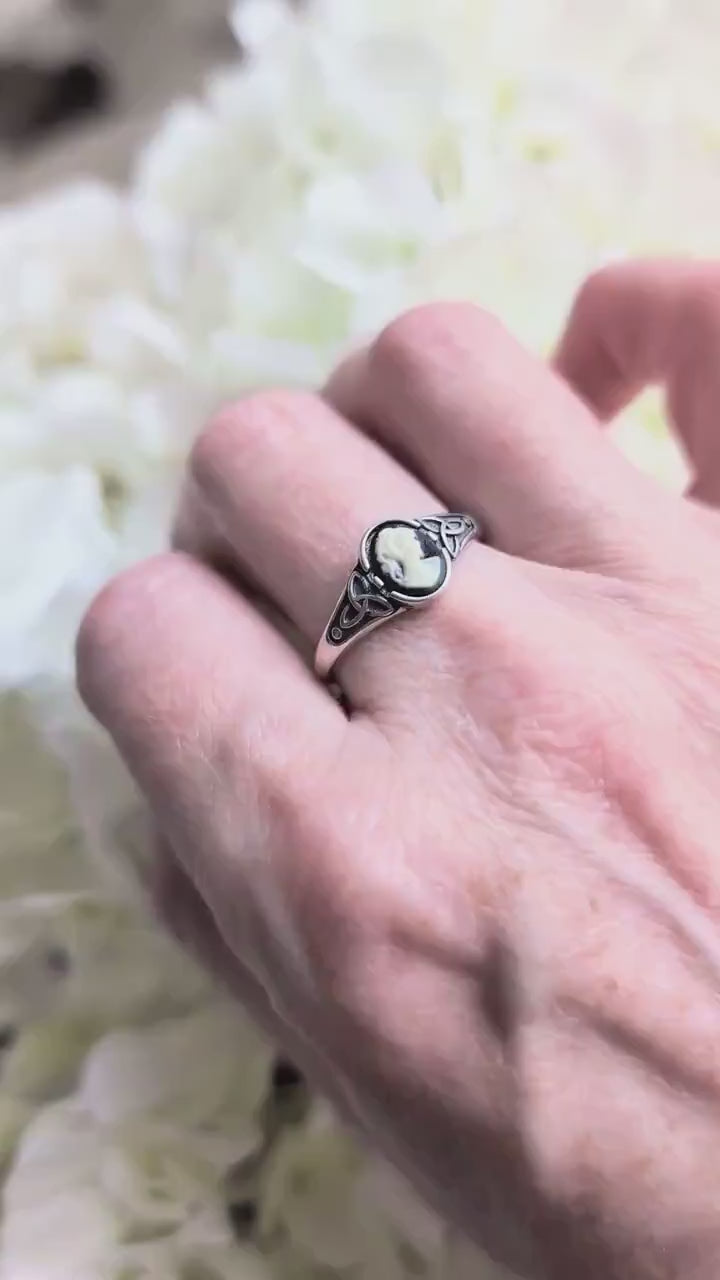 925 Sterling Silver Celtic Knot Cameo Ring - Heritage Style Jewelry with an ivory on black cameo shown on a hand.