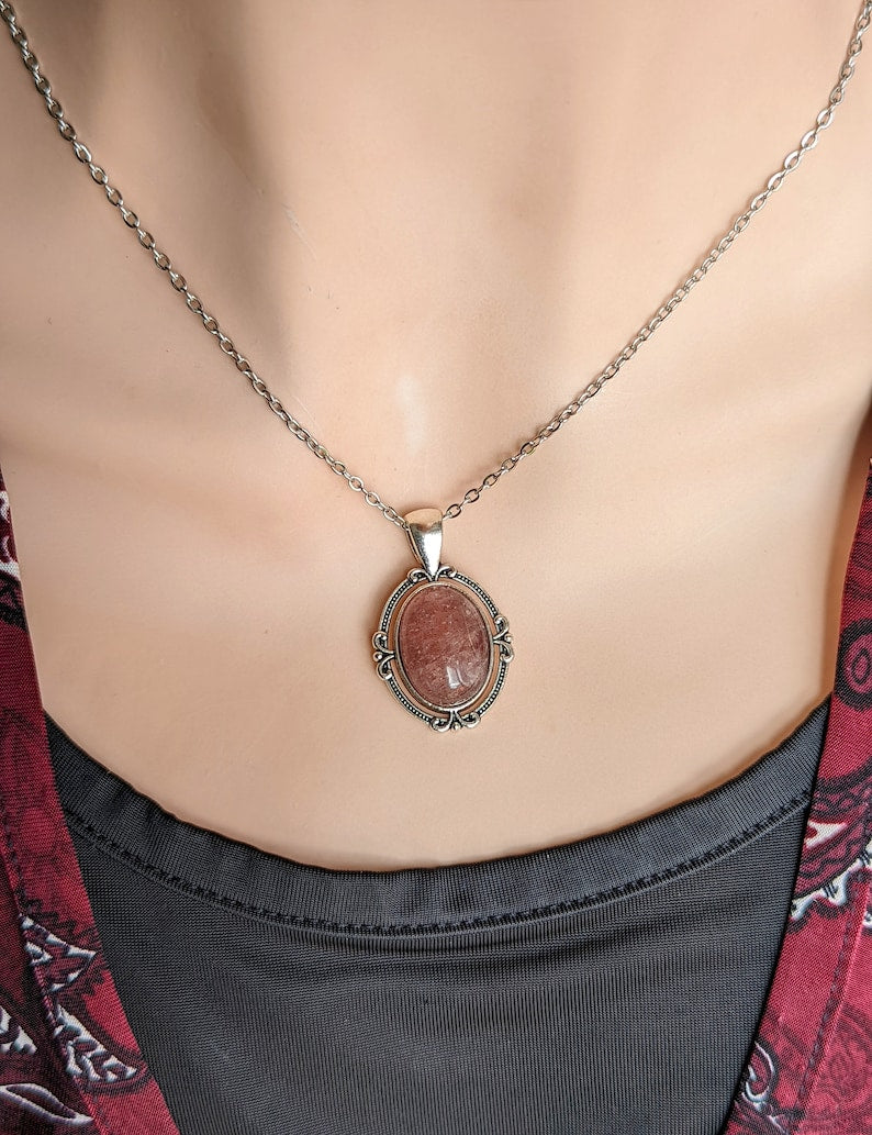 Medium Pink Strawberry Quartz Crystal Necklace - Silver Flourish Pendant Setting being worn by a mannequin.