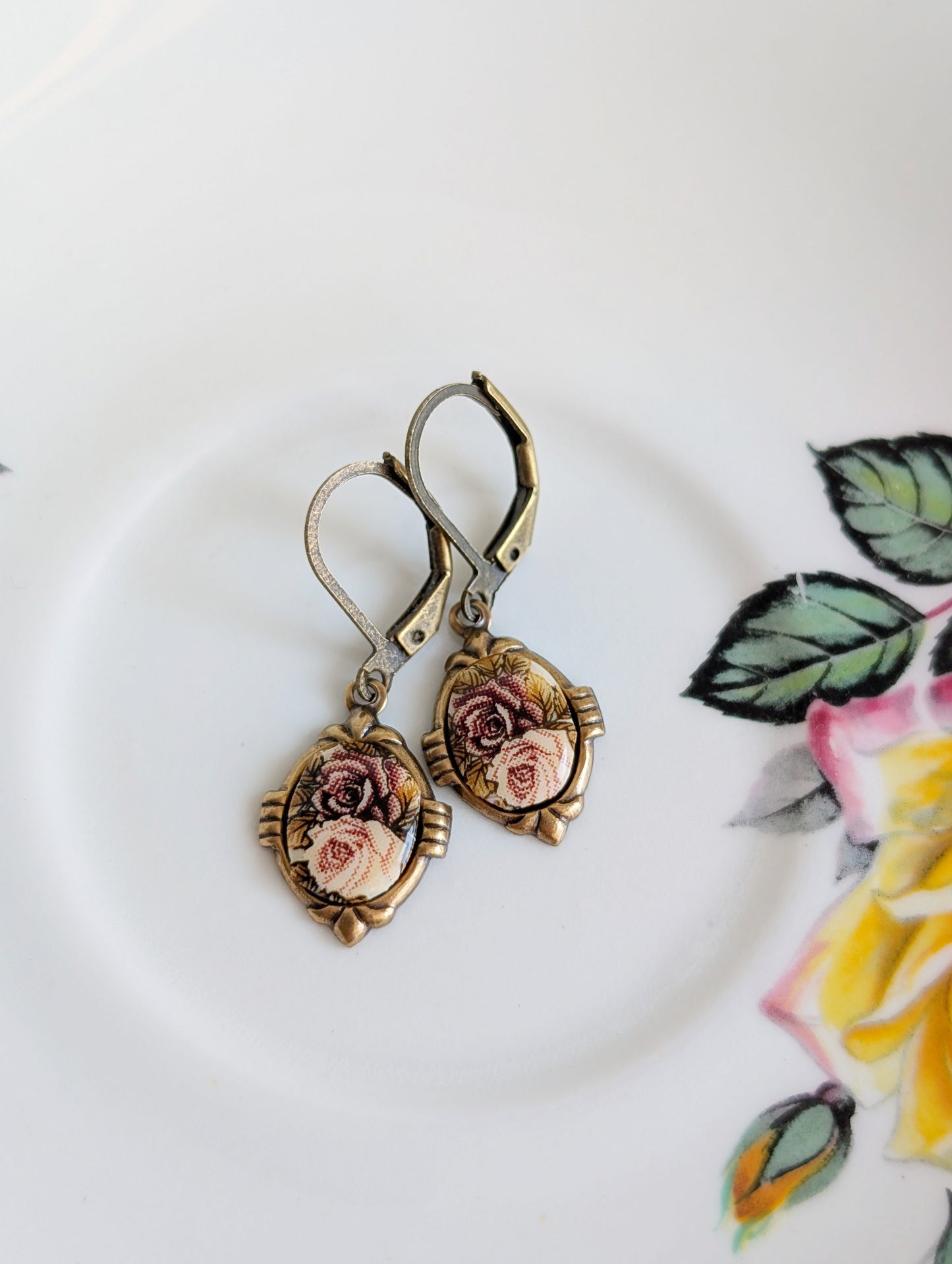 Pink Floral Porcelain Cabochon Earrings - Art Deco Frame - Victorian Style on a decorative plate with floral design